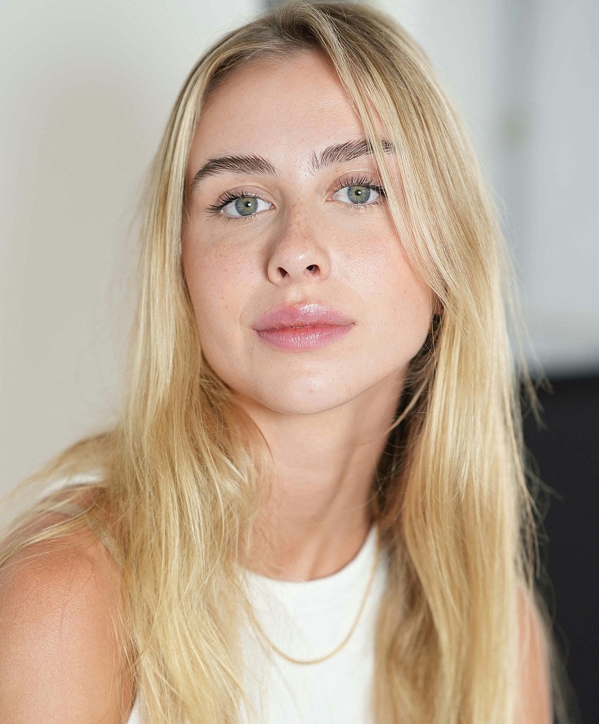 Smiling woman relaxing on a couch.