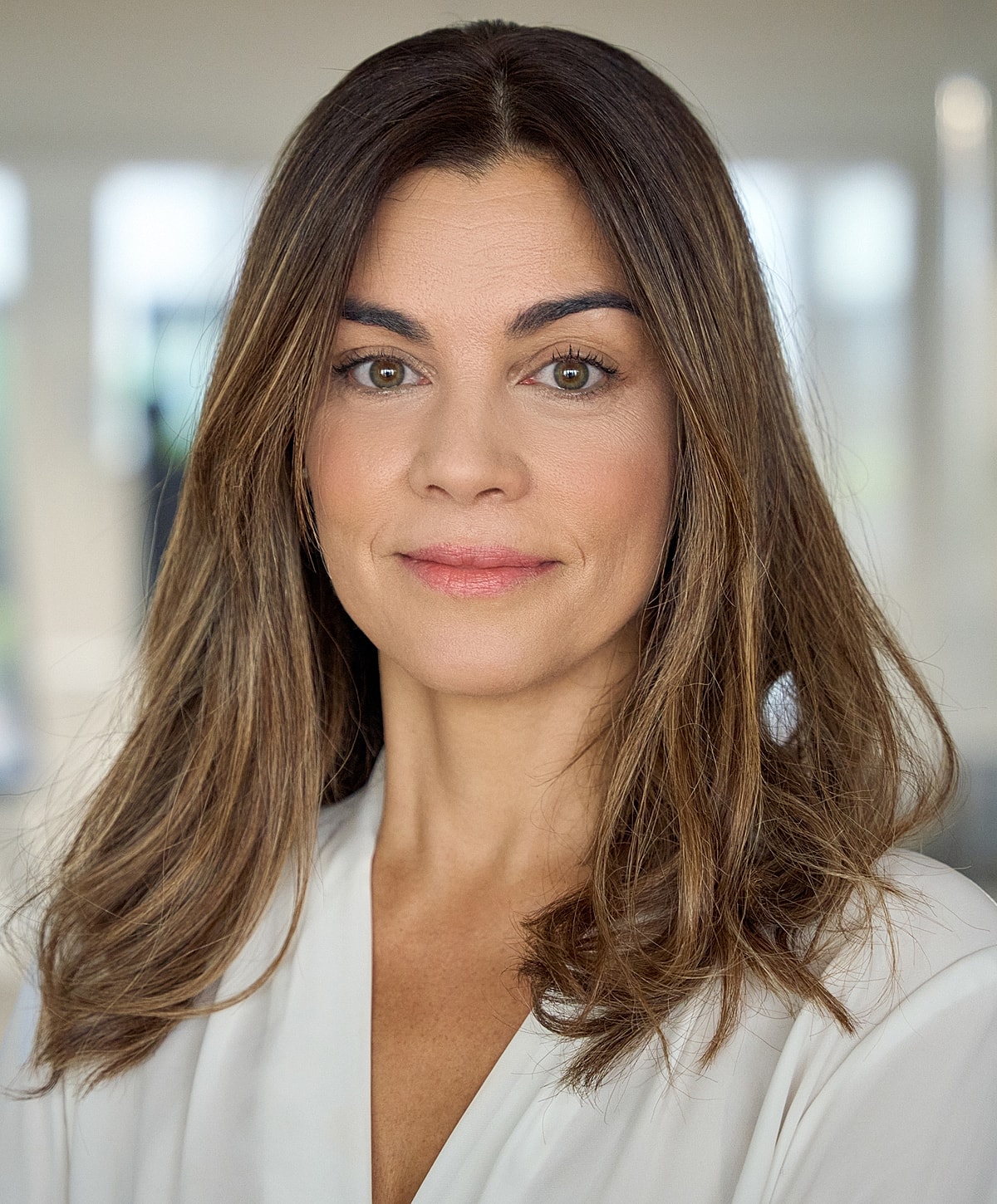 Smiling woman relaxing on a couch.