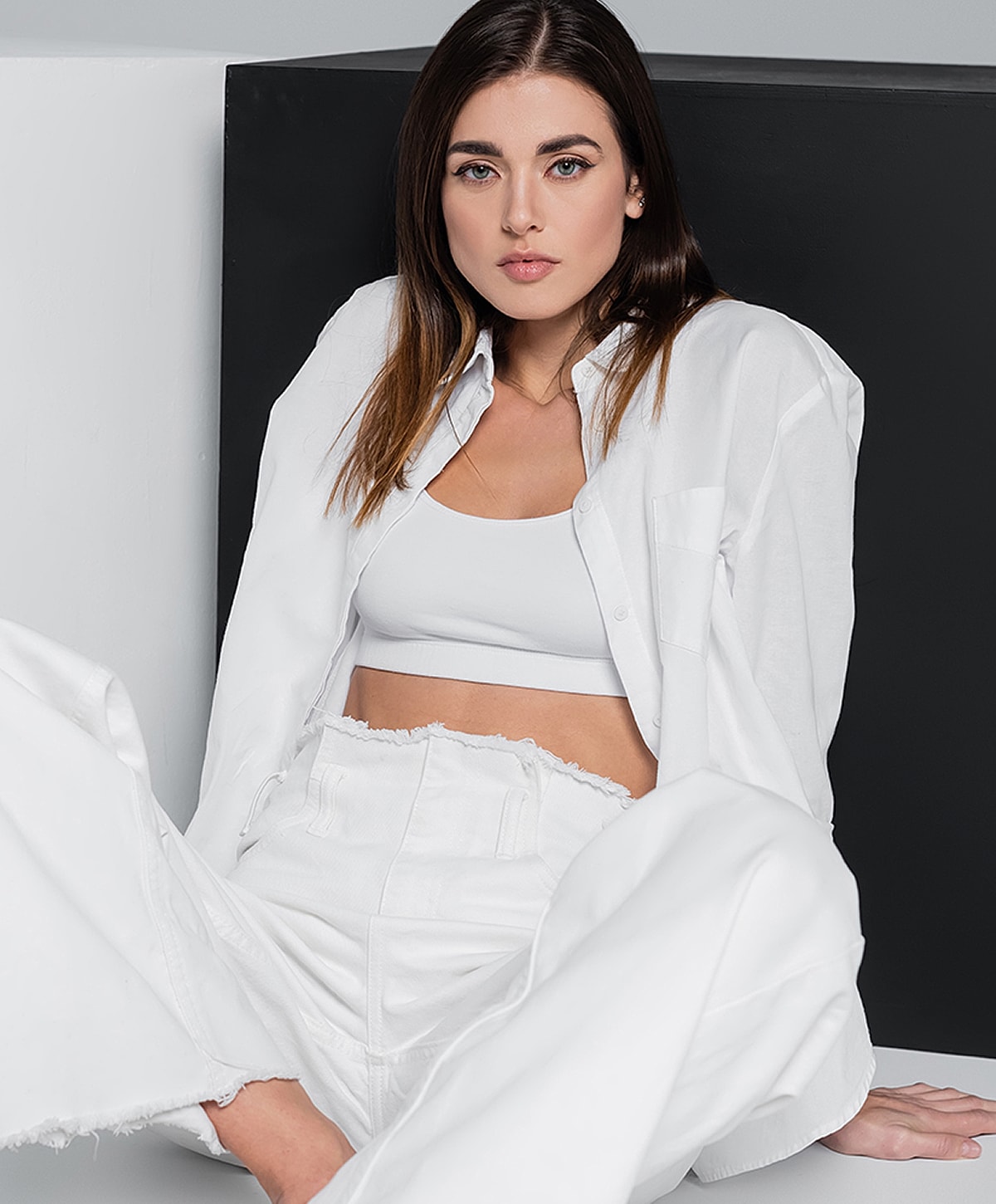 Model in blue activewear striking a pose.