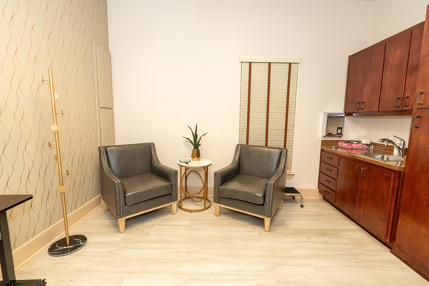 Cozy seating area with kitchenette and natural light.